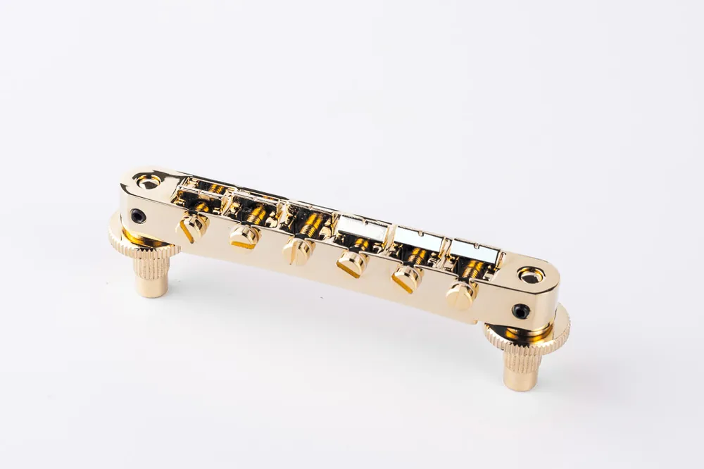 Online Kaufen TonePros NVR2P G - Tune-O-Matic Bridge with Pre-Notched Saddles (Standard Nashville Posts) - Gold